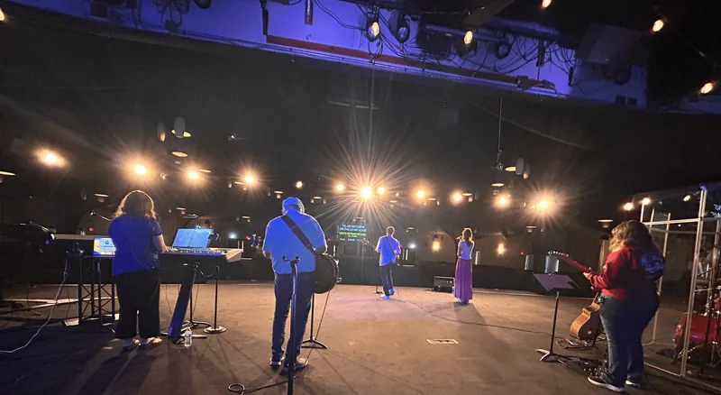Countryside musicians leading worship, seen from the stage